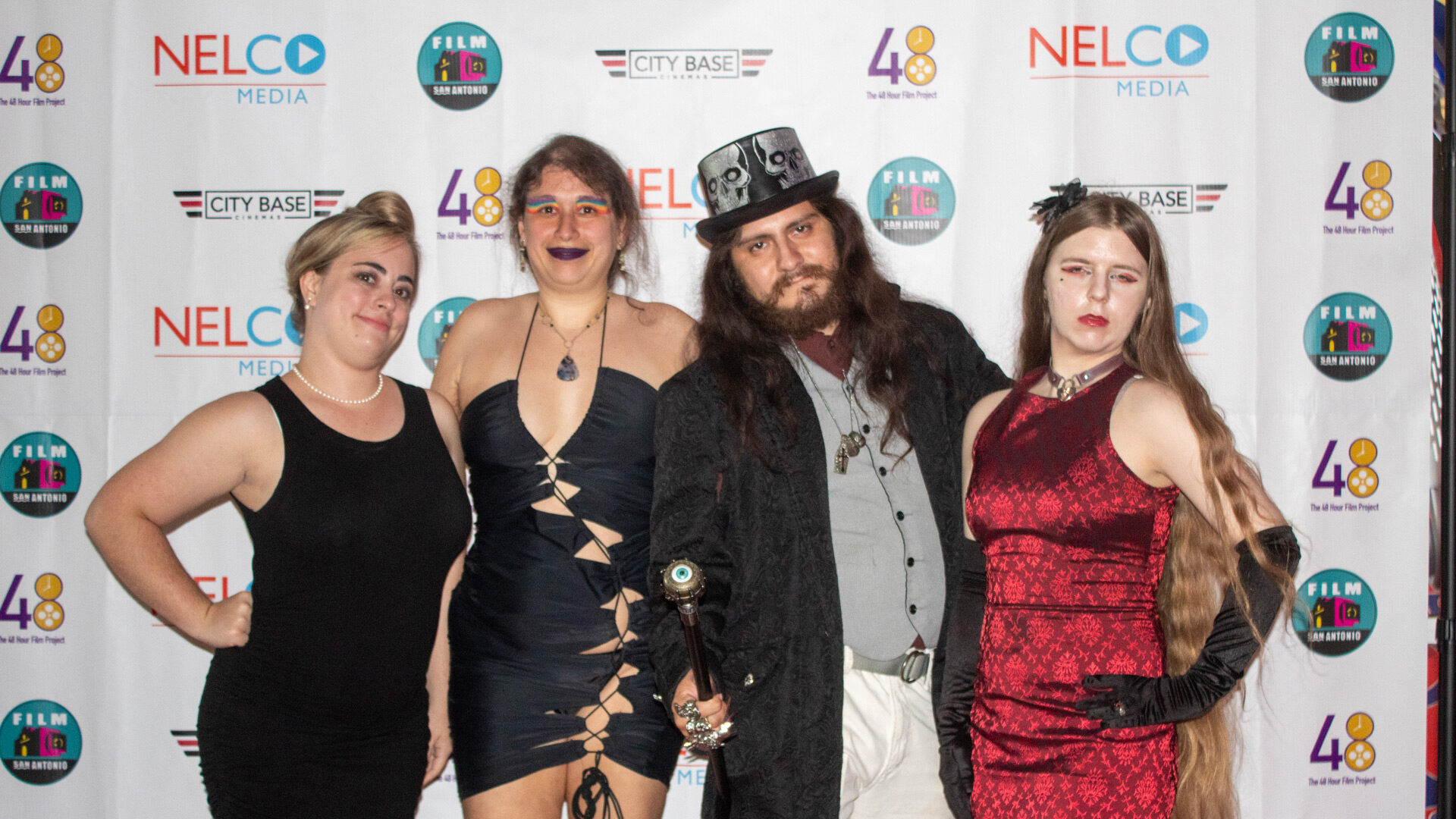 Cast stand with director Ellice Sanchez at red carpet event